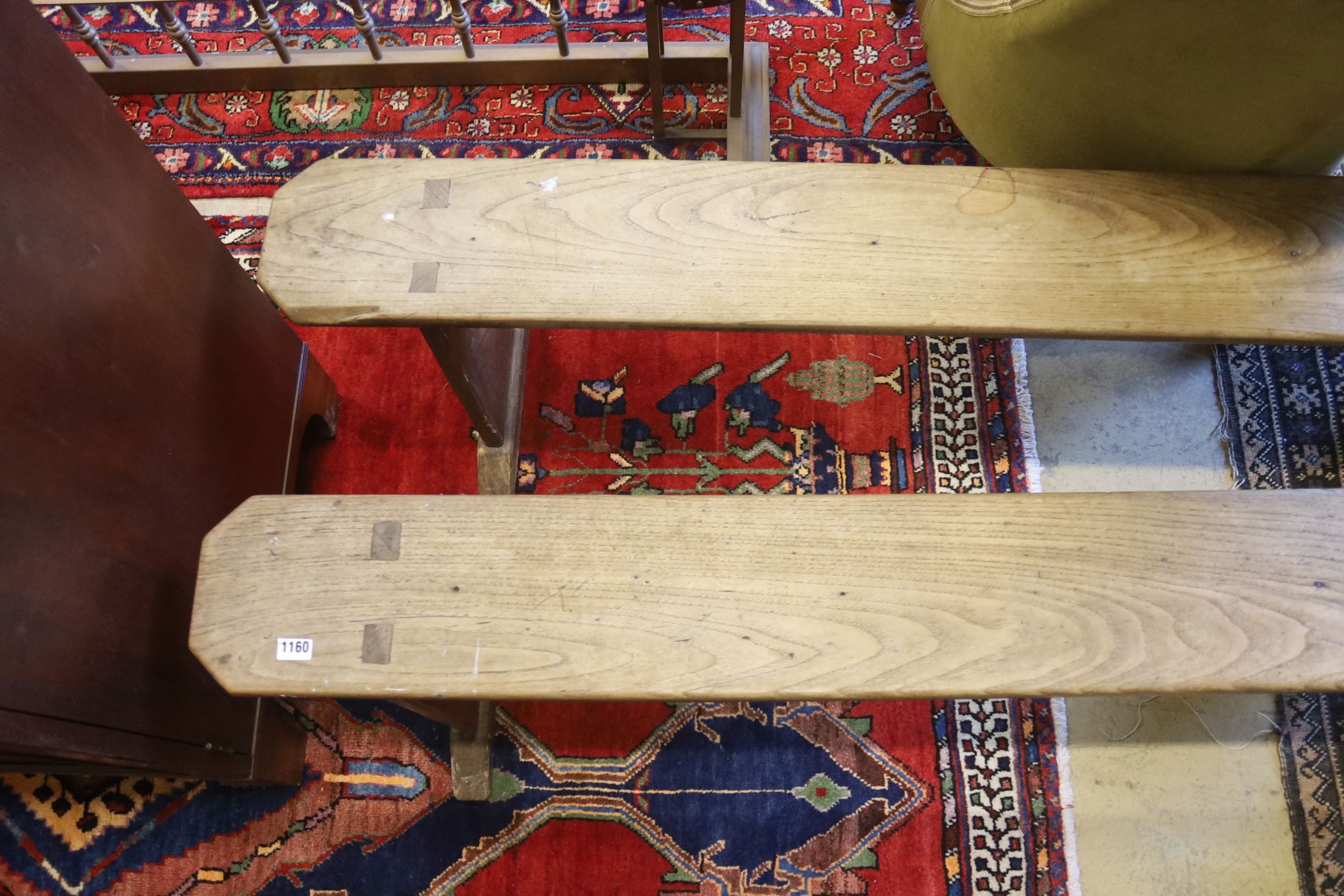 A pair of 19th century provincial elm benches, length 161cm, depth 18cm, height 46cm